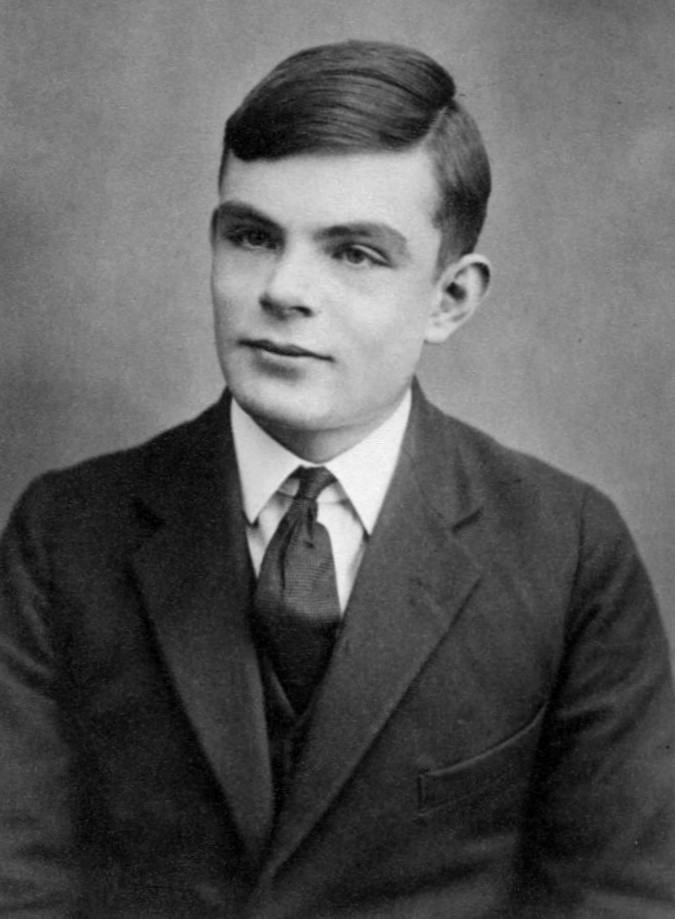 Black-and-white portrait of a person wearing a suit and tie